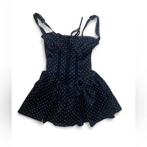 Black polka dot skater babydoll dress with and tie back in size Small. New